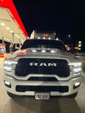 RAM truck at a gas station at night